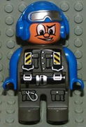 Duplo Figure, Male Action Wheeler, Dark Gray Legs, Dark Gray Jumpsuit, Blue Arms, Blue Aviator Helmet with Goggles 