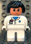 Duplo Figure, Female Medic, White Legs, White Top with Pocket and EMT Star of Life Pattern, Black Hair 