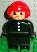 Duplo Figure, Male Fireman, Black Legs, Black Top with 3 White Buttons, Red Aviator Helmet 