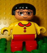 Duplo Figure, Child Type 2 Girl, Red Legs, Yellow Sweater, Black Hair, Glasses 