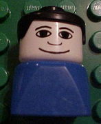 Duplo 2 x 2 x 2 Figure Brick Early, Male on Blue Base, Black Hair, Wide Smile 