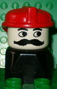 Duplo 2 x 2 x 2 Figure Brick Early, Male on Black Base, Moustache, Red Hat (Firefighter) 